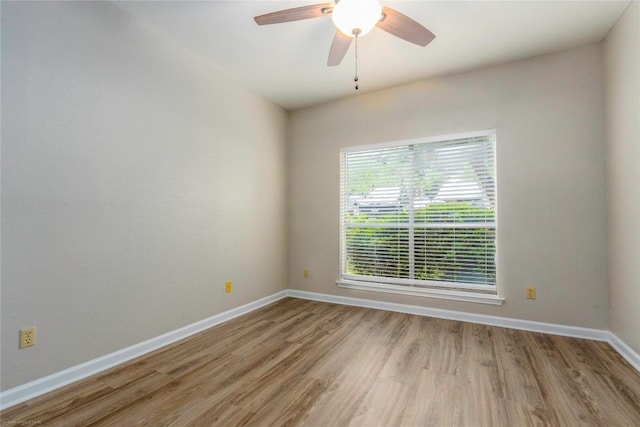 2450 Wickersham Ln Unit 1001, Austin, TX 78741 - empty room featuring light wood-type flooring and ceiling fan