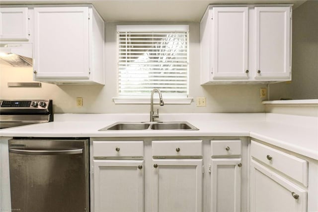 2450 Wickersham Ln Unit 1001, Austin, TX 78741 - kitchen featuring appliances with stainless steel finishes, ventilation hood, white cabinets, and light countertops