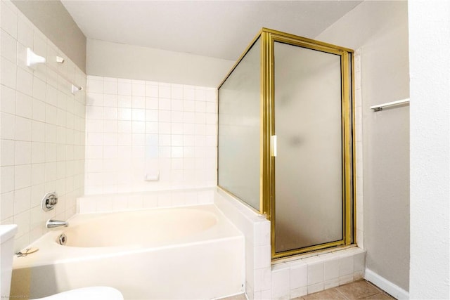 2450 Wickersham Ln Unit 1001, Austin, TX 78741 - bathroom featuring a shower with door, a bath, and tile patterned flooring