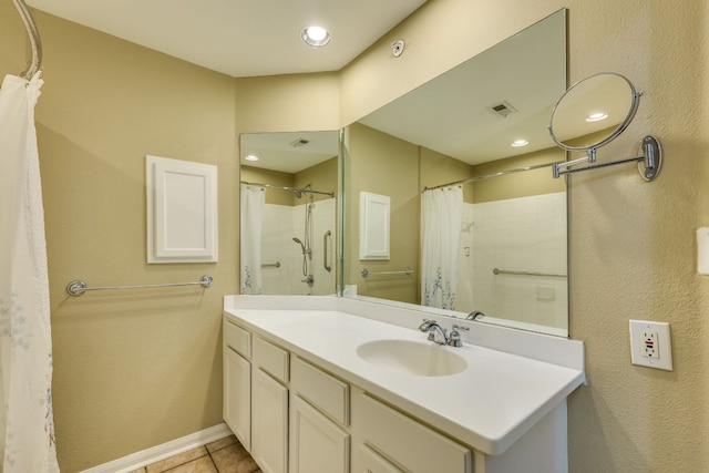 9525 N Capital Of Texas Hwy Unit 414, Austin, TX 78759 - bathroom featuring vanity, tile patterned flooring, a shower with shower curtain, and recessed lighting