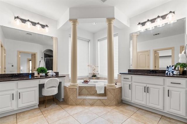 7608 Journeyville Dr, Austin, TX 78735 - bathroom featuring ornate columns, vanity, tile patterned flooring, and a garden tub
