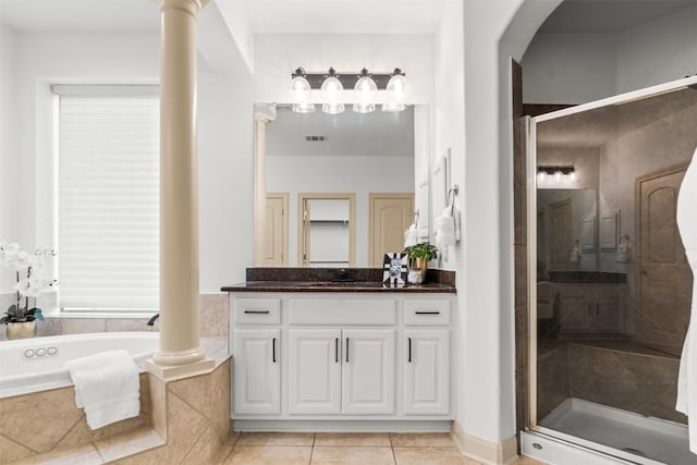 7608 Journeyville Dr, Austin, TX 78735 - bathroom with vanity, a bath, a stall shower, and ornate columns