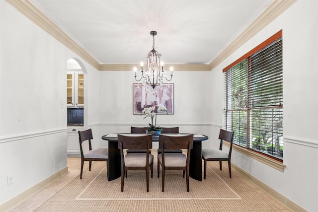 7608 Journeyville Dr, Austin, TX 78735 - dining room featuring a chandelier, arched walkways, and crown molding
