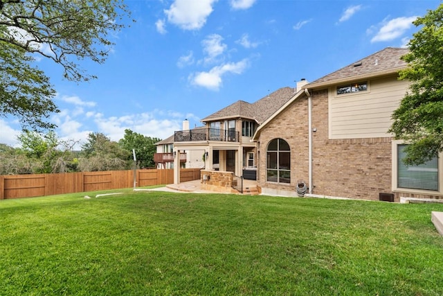 7608 Journeyville Dr, Austin, TX 78735 - back of house with a balcony, a fenced backyard, a patio area, brick siding, and a chimney