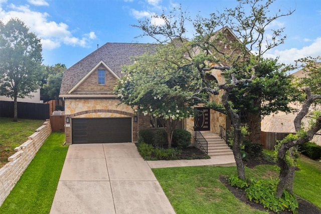 7608 Journeyville Dr, Austin, TX 78735 - view of front of property with driveway, stone siding, and brick siding