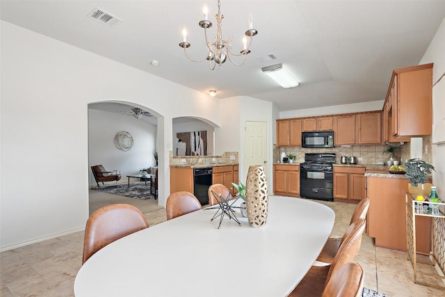 1917 Golden Sunrise Ln, Pflugerville, TX 78660 - dining room featuring arched walkways and a chandelier