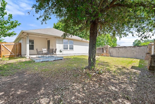 1917 Golden Sunrise Ln, Pflugerville, TX 78660 - rear view of property featuring a fenced backyard, stucco siding, and a patio