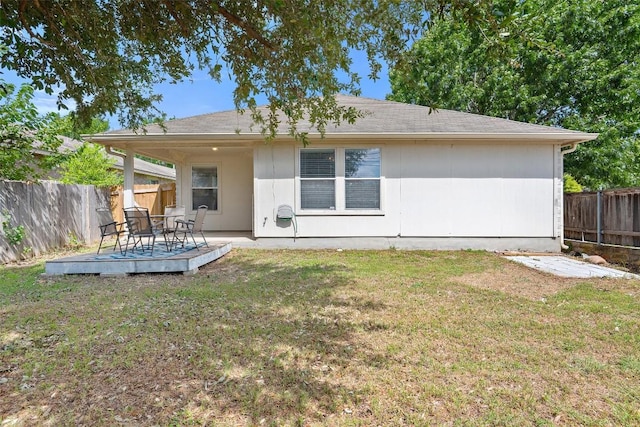 1917 Golden Sunrise Ln, Pflugerville, TX 78660 - rear view of house with a fenced backyard and a wooden deck