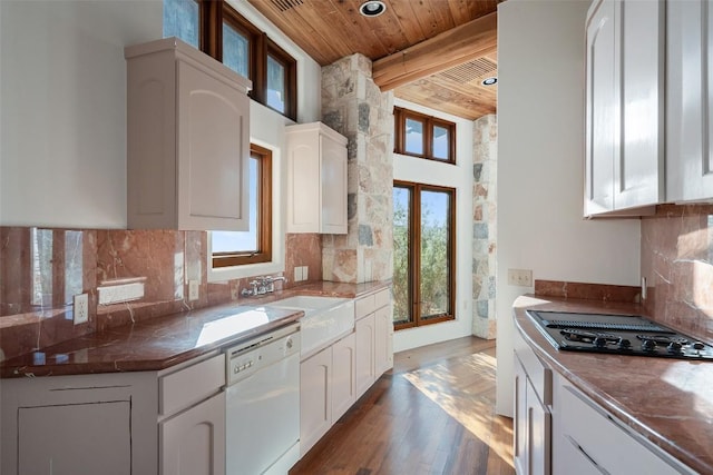 19201 Moreh Peak Pass, Austin, TX 78738 - kitchen with black electric cooktop, white dishwasher, a wood ceiling with exposed beams, tasteful backsplash, and recessed lighting