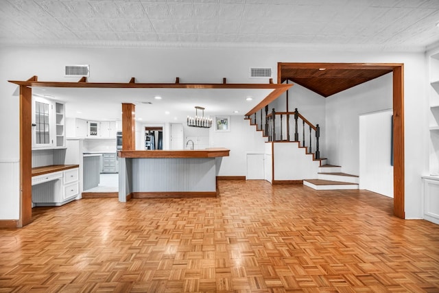 1806 S Main St, Georgetown, TX 78626 - kitchen featuring smart refrigerator, a peninsula, stainless steel oven, white cabinetry, and open floor plan