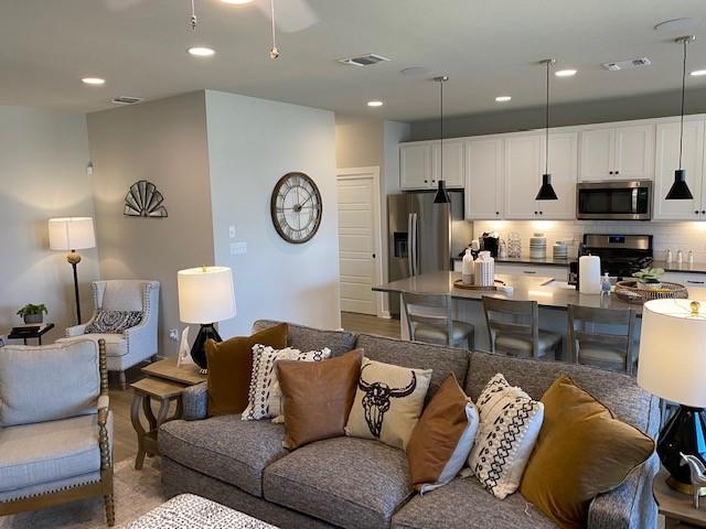 303 Watercourse Way, Bastrop, TX 78602 - living area with recessed lighting