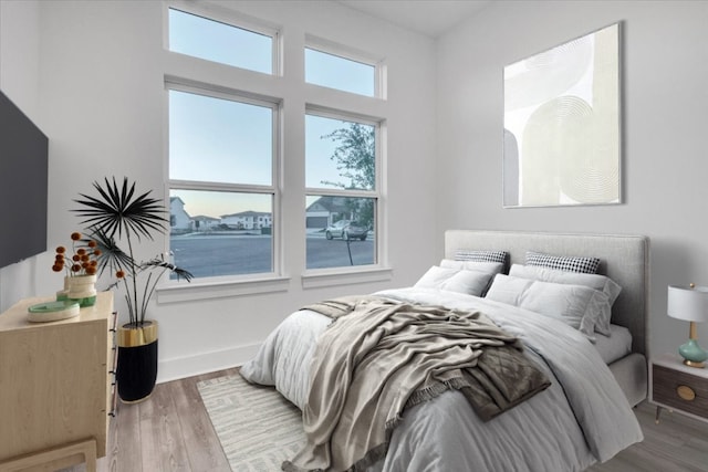 8609 San Giano Cv, Round Rock, TX 78665 - bedroom featuring wood finished floors and baseboards