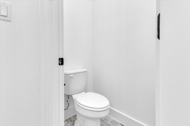 8609 San Giano Cv, Round Rock, TX 78665 - bathroom featuring toilet and baseboards