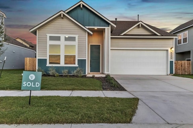 8609 San Giano Cv, Round Rock, TX 78665 - view of front of property with board and batten siding, a garage, and driveway
