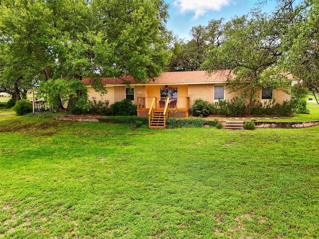 2415 W Fm 2147 W, Horseshoe Bay, TX 78657 - ranch-style home with a wooden deck, a front yard, and brick siding