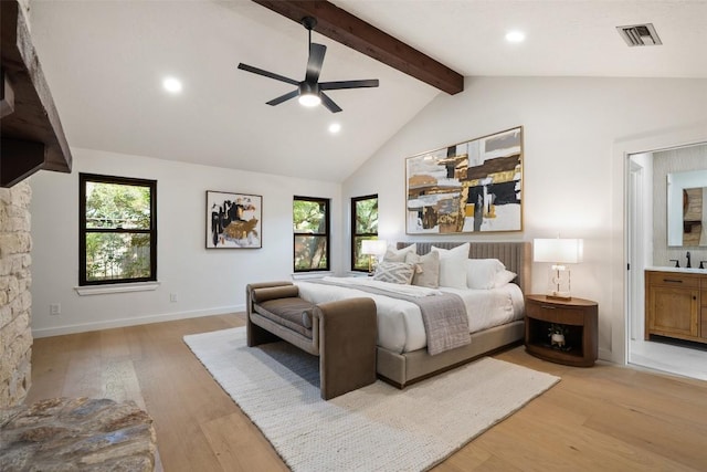 506 Explorer, Lakeway, TX 78734 - bedroom featuring light wood finished floors, multiple windows, recessed lighting, connected bathroom, and ceiling fan