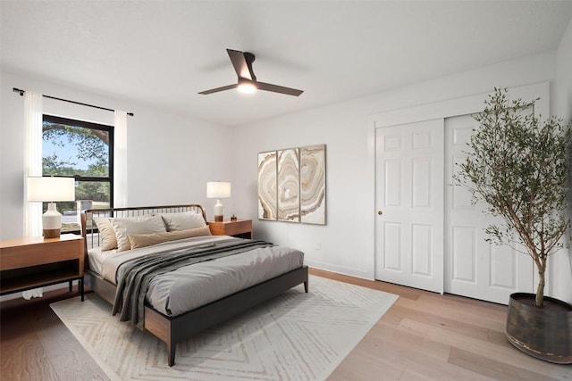 506 Explorer, Lakeway, TX 78734 - bedroom with light wood finished floors, ceiling fan, and a closet