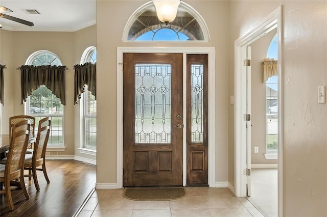 100 Davis Ct, Thorndale, TX 76577 - foyer entrance with ceiling fan, crown molding, and light wood-type flooring