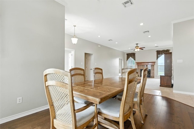 100 Davis Ct, Thorndale, TX 76577 - dining room with a ceiling fan, light wood finished floors, a fireplace, recessed lighting, and ornamental molding