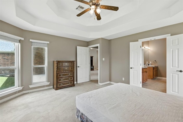 100 Davis Ct, Thorndale, TX 76577 - bedroom with a raised ceiling, light carpet, and ensuite bath