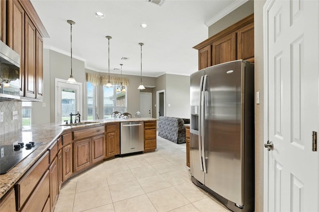 100 Davis Ct, Thorndale, TX 76577 - kitchen with appliances with stainless steel finishes, ornamental molding, brown cabinets, a peninsula, and pendant lighting