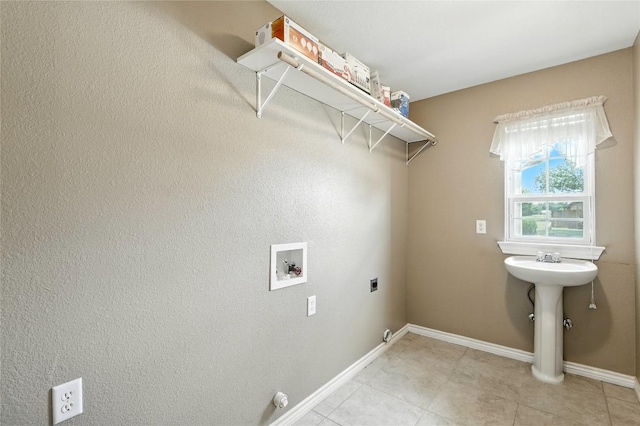 100 Davis Ct, Thorndale, TX 76577 - laundry area with hookup for a washing machine, electric dryer hookup, gas dryer hookup, and light tile patterned flooring