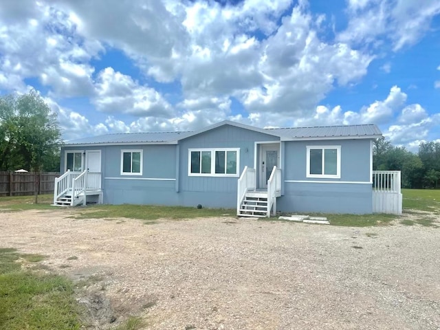 149 Gato Rd, Cedar Creek, TX 78612 - view of front of home with a metal roof