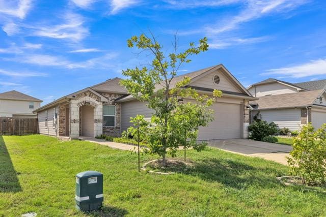 14802 Tuff Rd, Manor, TX 78653 - single story home with a garage and concrete driveway
