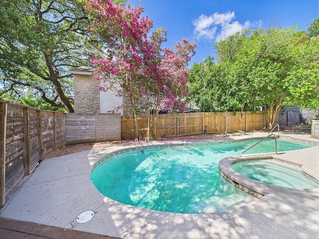6108 Shadow Valley Dr Unit B, Austin, TX 78731 - view of swimming pool featuring a fenced backyard and a pool with connected hot tub
