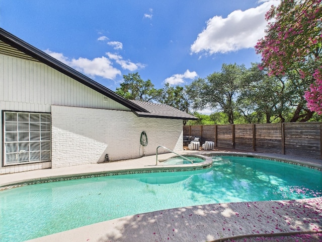 6108 Shadow Valley Dr Unit B, Austin, TX 78731 - view of swimming pool with an in-ground hot tub and a fenced backyard