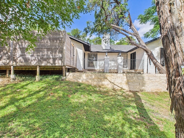 6108 Shadow Valley Dr Unit B, Austin, TX 78731 - back of house featuring a yard and a chimney
