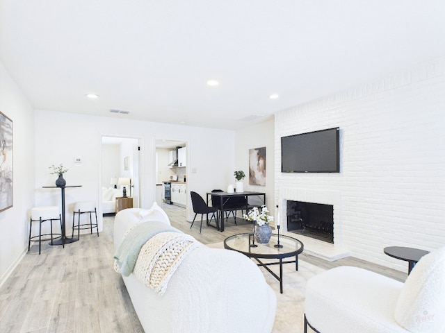 6108 Shadow Valley Dr Unit B, Austin, TX 78731 - living area featuring light wood finished floors, a fireplace, and recessed lighting