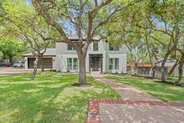 9402 Caracas Dr, Austin, TX 78733 - view of front facade featuring a front lawn, a garage, and driveway
