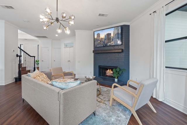 9402 Caracas Dr, Austin, TX 78733 - living room with wood finished floors, stairway, crown molding, a fireplace, and a chandelier
