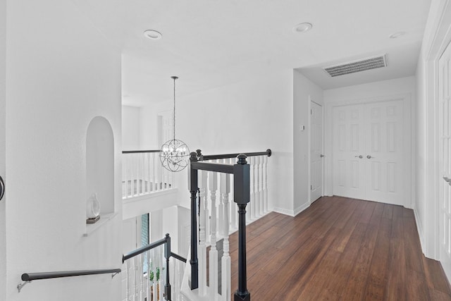 9402 Caracas Dr, Austin, TX 78733 - hallway featuring an upstairs landing, a chandelier, wood finished floors, and recessed lighting