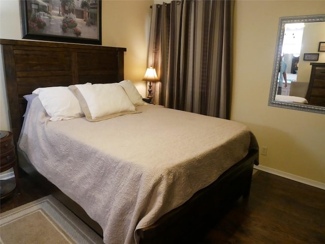 1501 W Braker Ln Unit 1262B, Austin, TX 78758 - bedroom featuring wood finished floors and baseboards