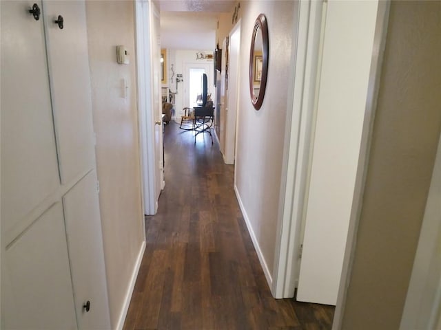 1501 W Braker Ln Unit 1262B, Austin, TX 78758 - corridor featuring dark wood finished floors and baseboards