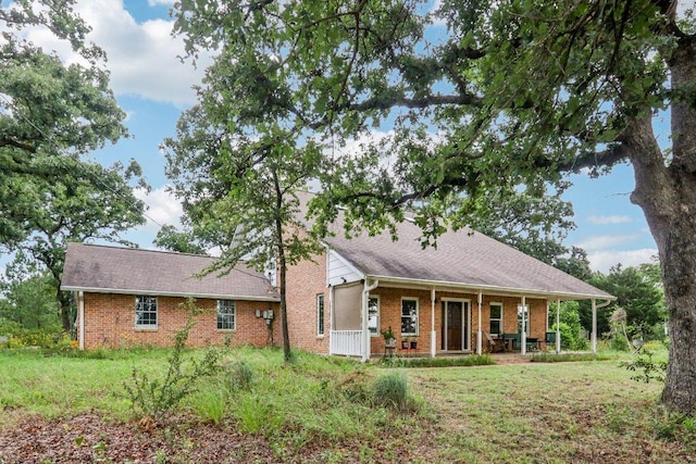 428 Gotier Trace Rd, Smithville, TX 78957 - view of front of house with brick siding and covered porch