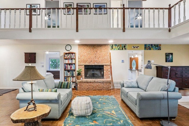 428 Gotier Trace Rd, Smithville, TX 78957 - living room featuring a high ceiling and a brick fireplace