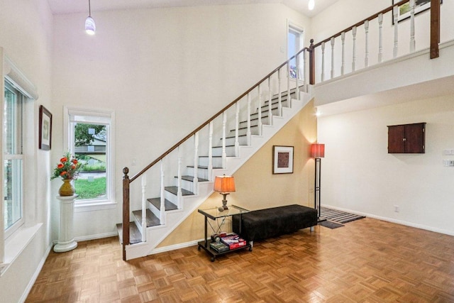 428 Gotier Trace Rd, Smithville, TX 78957 - staircase featuring a high ceiling and baseboards