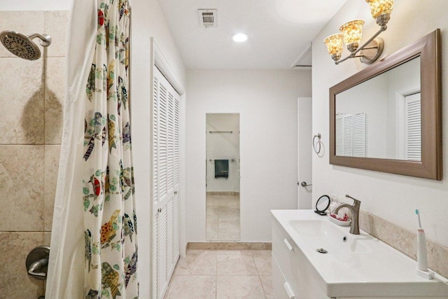 428 Gotier Trace Rd, Smithville, TX 78957 - bathroom with vanity, tile patterned flooring, a shower with curtain, and a closet