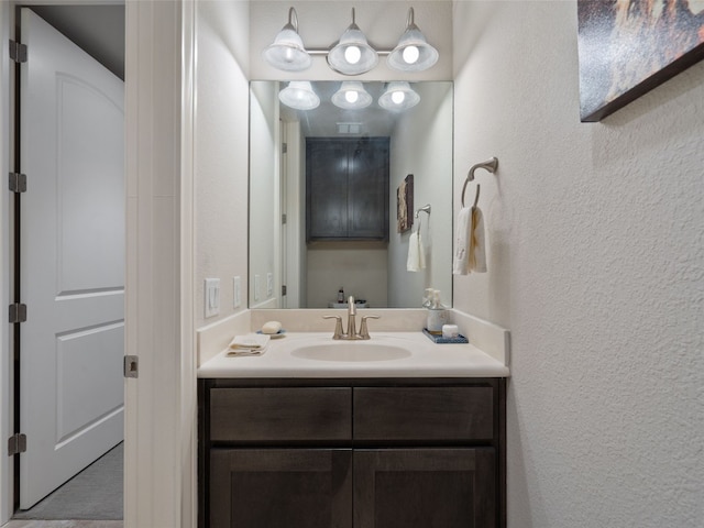 106 Bella Toscana Ave Unit 3204, Lakeway, TX 78734 - bathroom featuring a textured wall and vanity