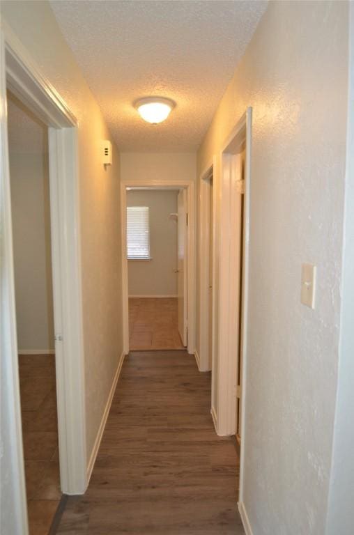2200 Frontier Trl, Round Rock, TX 78681 - hall featuring a textured ceiling and wood finished floors