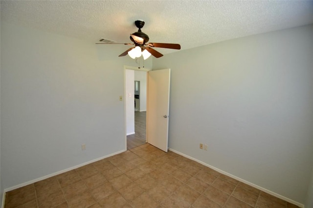 2200 Frontier Trl, Round Rock, TX 78681 - unfurnished room featuring ceiling fan and a textured ceiling