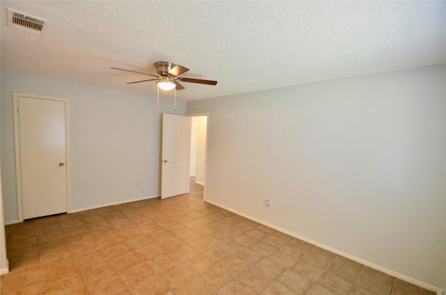 2200 Frontier Trl, Round Rock, TX 78681 - unfurnished room featuring a ceiling fan and a textured ceiling