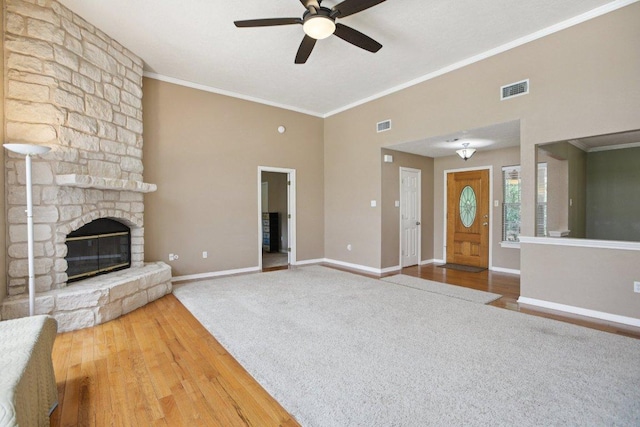 148 Oak Ridge Dr, Cedar Creek, TX 78612 - unfurnished living room featuring a ceiling fan, carpet flooring, ornamental molding, a high ceiling, and wood finished floors