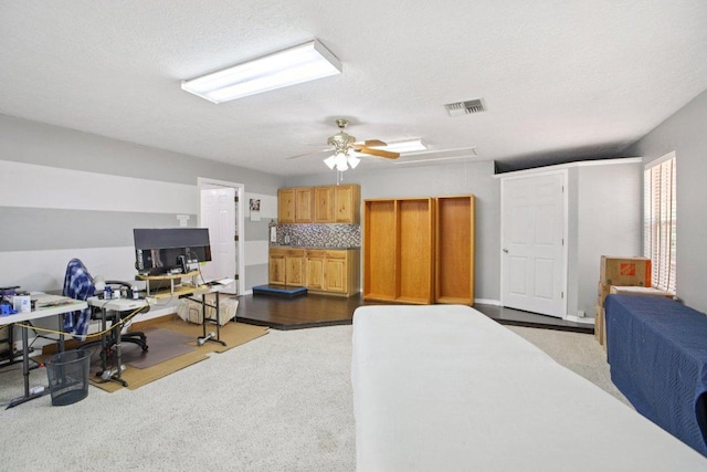 148 Oak Ridge Dr, Cedar Creek, TX 78612 - carpeted office featuring a ceiling fan and a textured ceiling