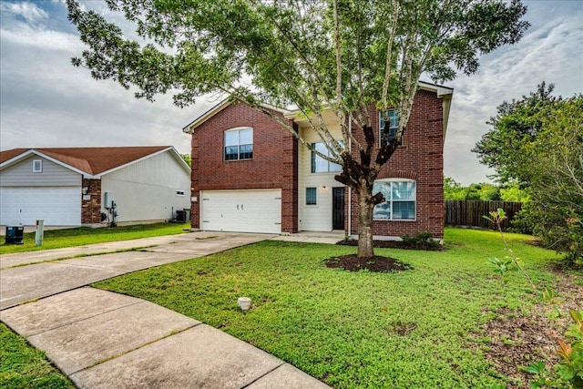 618 Lavaca Loop, Elgin, TX 78621 - view of front of house with brick siding, concrete driveway, and an attached garage