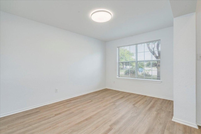 618 Lavaca Loop, Elgin, TX 78621 - spare room with light wood-style flooring and baseboards