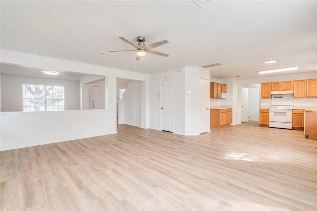 618 Lavaca Loop, Elgin, TX 78621 - unfurnished living room featuring light wood finished floors and a ceiling fan